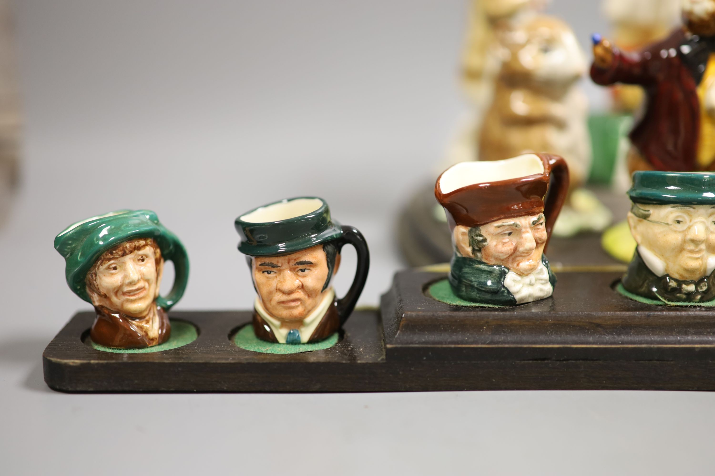 A collection of Royal Doulton miniature character mugs, figurines, series plate etc